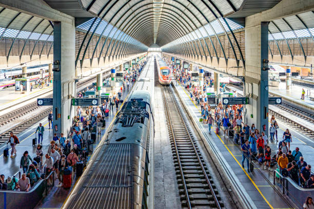 Seville Santa Justa Train Station, Spain The train parked at the platform is waiting for tourists boarding. Seville Santa Justa Train Station view, Spain. santa justa lift portugal stock pictures, royalty-free photos & images