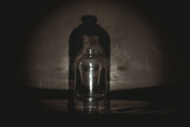 istock Still life of small bottle in low light 2192758657