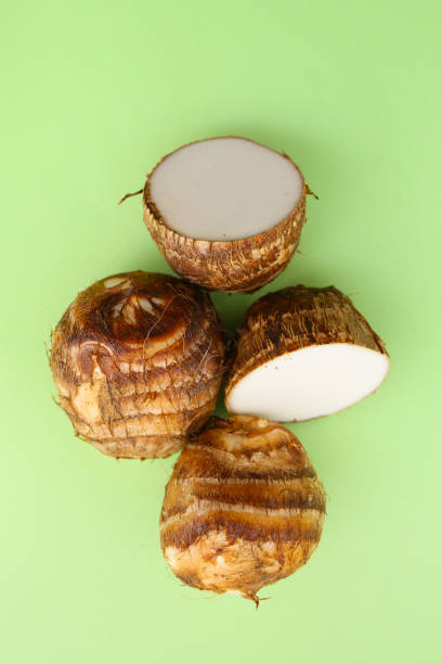 istock taro root vegetable isolated on a green background 2192759578