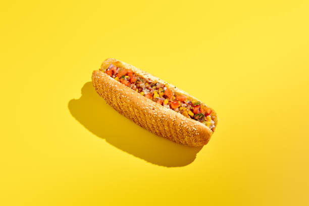 istock Delectable American cheesesteak with marbled beef, vegetable salsa, and a sesame bun on a yellow background. A minimalist and modern take on food photography showcases this enticing street food. 2192760860
