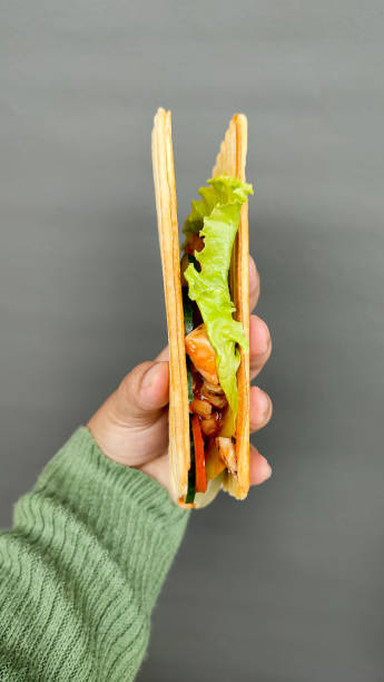 istock Holding a sandwich Crispy toast shot from the side angle. 2192760941