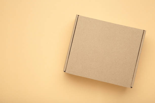 istock Brown Paper box Cardboard box on beige background 2192761706