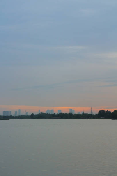 istock Serene Lake View at Dusk with City Skyline 2192762332