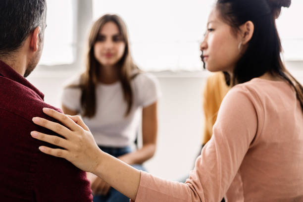 istock Diverse young teenage people receiving support during a therapy session. 2192763174