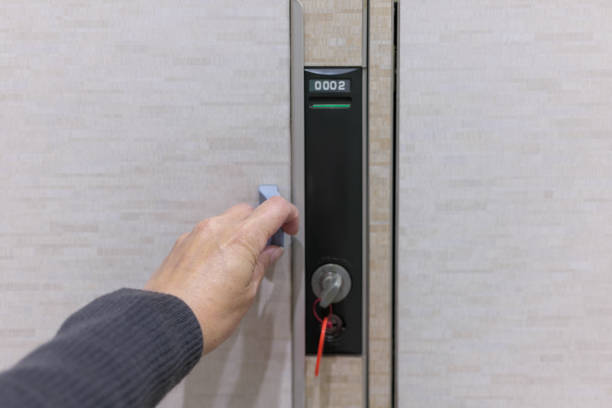 istock A woman's hand holding a handle, opening a coin locker door 2192763730