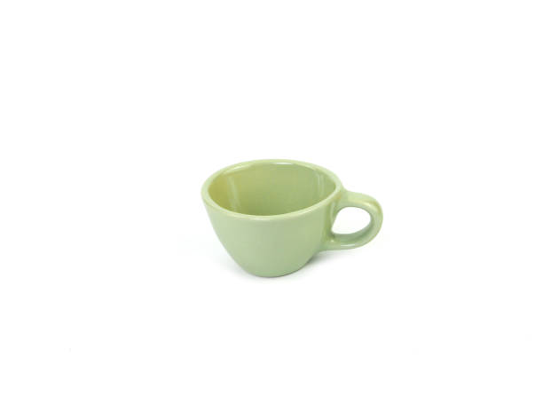 istock Side view, empty light-green mug isolated on white background. Blank  light green ceramic cup mockup and template for design, and banner. Use for home or restaurant 2192764789