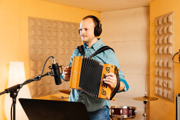 istock Diatonic accordion player records music in a professional studio setting 2192765732