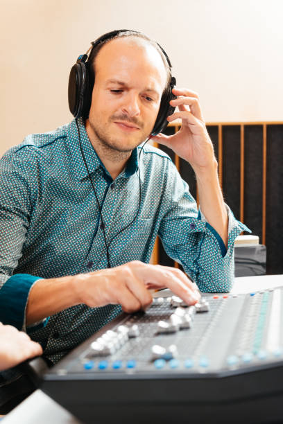 istock Balding Musician Engaged in Sound Mixing at a Recording Studio 2192765758