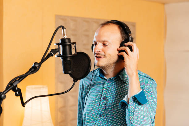 istock Balding Singer Records Lively Vocals in a Professional Studio Environment 2192765810