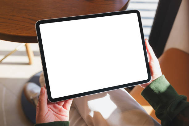 istock Mockup image of a woman holding digital tablet with blank desktop screen 2192767906