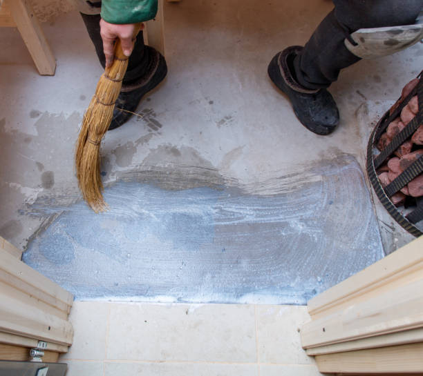 istock A man is sweeping the floor with a broom 2192768859