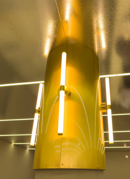 istock A gold colored pole with four lights on it 2192769297