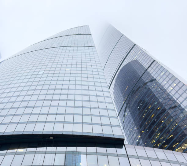 istock A tall building with a cloudy sky in the background 2192769335