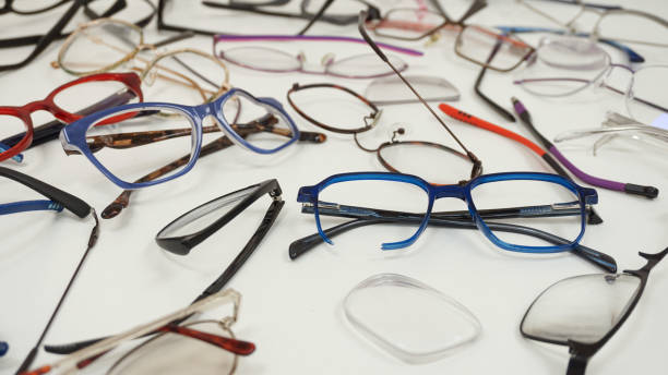 istock Assortment of broken optical eyeglasses, broken hinges, missing lenses 2192769632