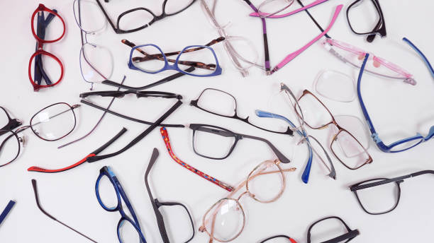 istock Assortment of broken optical eyeglasses, broken hinges, missing lenses 2192769753