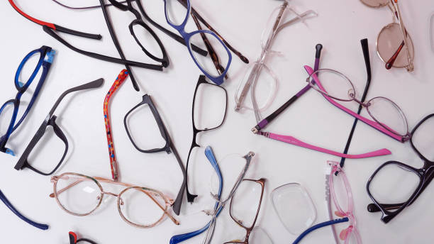 istock Assortment of broken optical eyeglasses, broken hinges, missing lenses 2192769794