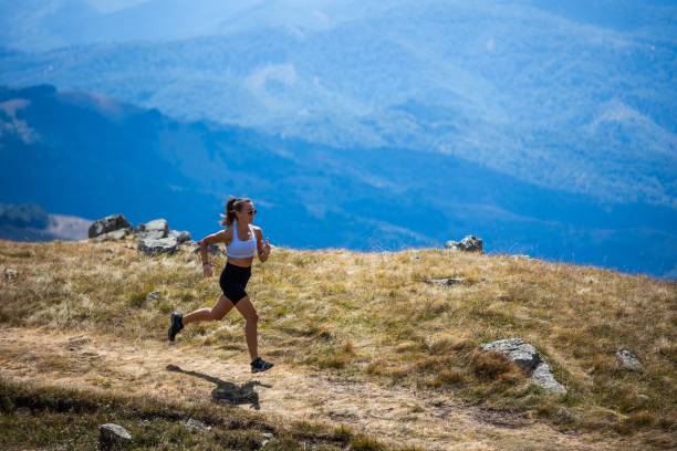istock Trail running with scenic mountain views. 2192772654
