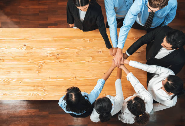 istock Multiracial business people make synergy hand stack together. Habiliment 2192772999