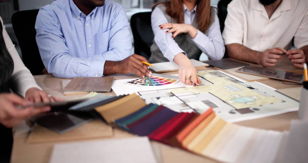 istock Designer Group At Desk Discussing Custom House 2192773945