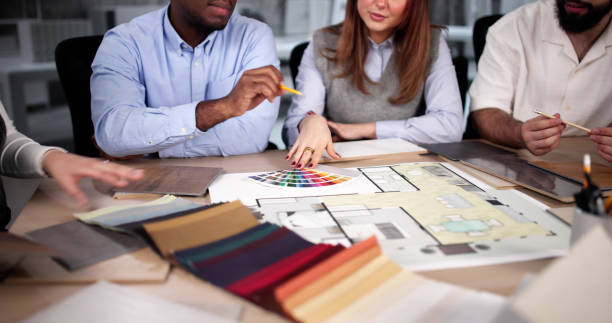 istock Designer Group At Desk Discussing Custom House 2192773960