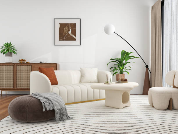 istock A modern living room with a white sofa, a round coffee table, a floor lamp, and various plants, featuring a minimalist and cozy design. 2192774597