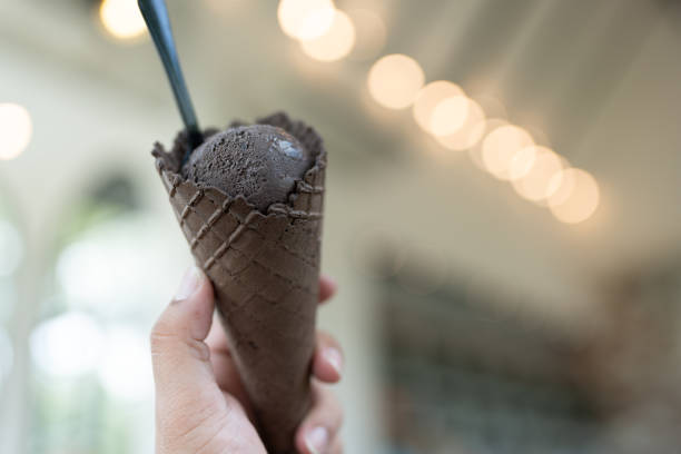 istock A charcoal cone of chocolate ice cream. 2192776462
