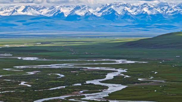 istock River,Snow Mountain,Bayinbuluke Grassland, Xinjiang, China, Asia.Grassland Ranch.Tianshan Mountains. 2192776607