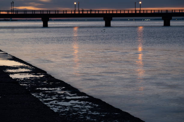 A bridge over the coast and a beautiful sunrise