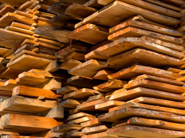 istock wooden boards Lumber construction site background 2192779010