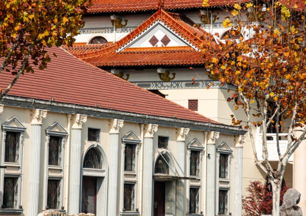 istock Traditional architecture with red tiled roofs and autumn trees. 2192779167