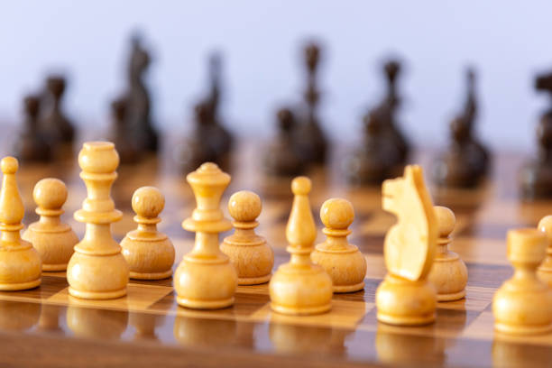istock Wooden white chess pieces on the chessboard 2192779377
