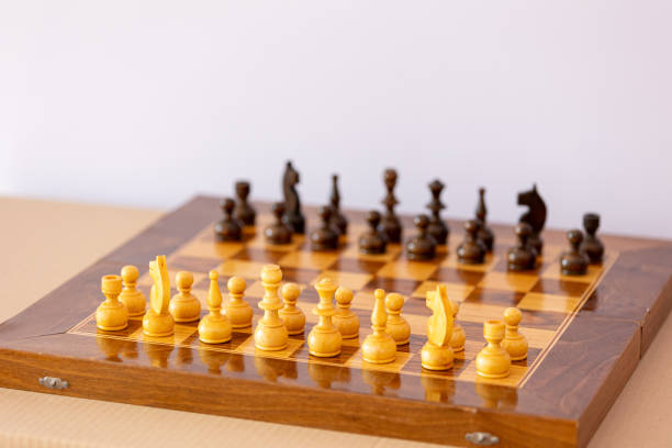 istock Wooden white chess pieces on the chessboard 2192779438