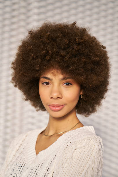 istock Young woman with afro hairstyle posing in studio 2192779511