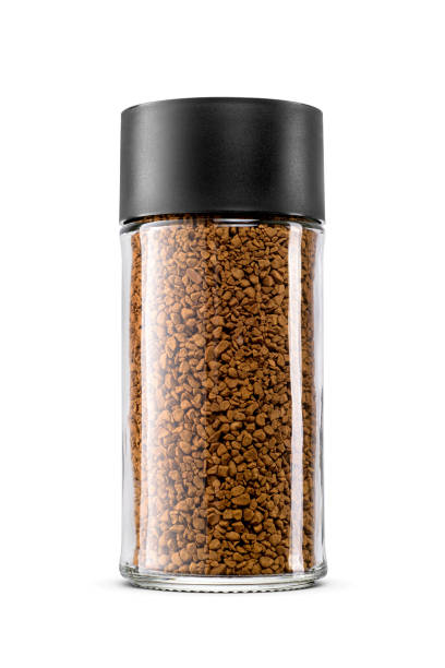 istock Glass jar is filled with instant coffee granules isolated on white. 2192779638