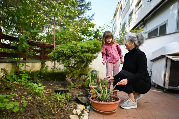 istock Joy and candid moments during garden care. 2192779833