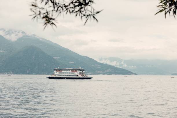 istock Ferry on Lake Como with misty mountain backdrop. 2192780082