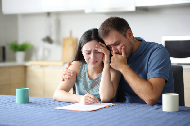istock Sar interracial couple reading paper contract 2192781327