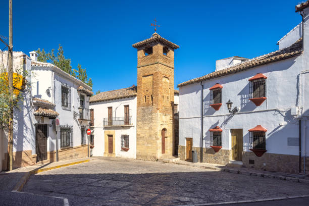 istock Ronda town in Spain. Historic town square with a distinctive stone tower and whitewashed buildings under a vibrant blue sky. 2192783234
