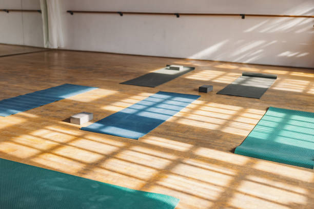 istock Unfolded Yoga Mats In A Pilates Studio Illuminated By Sunlight 2192783352
