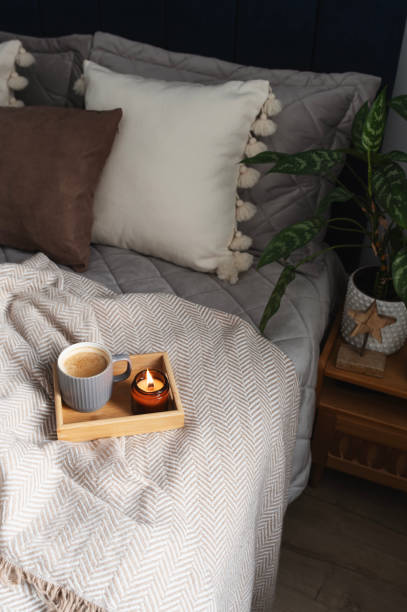 istock winter home aestetics with coffee and candle in modern bedroom 2192783751