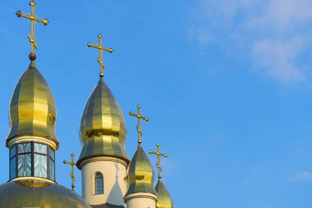 istock Christian cathedral with golden domes and blue clear sky 2192783864