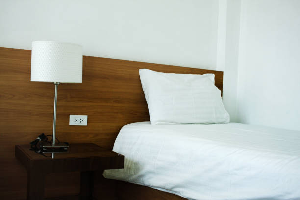 High Angle View Of Stacked Towel On Bed At Hotel