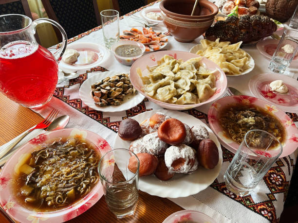 istock Traditional festive meal with diverse dishes served on a decorated dining table 2192788161