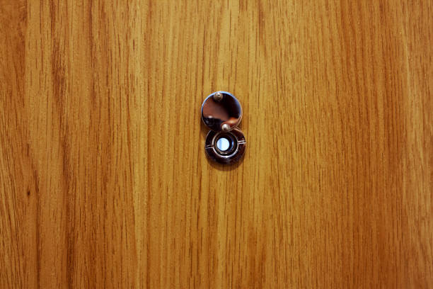 istock Close up view of door peephole 2192788165