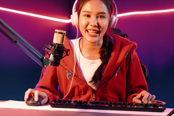 istock Host channel smiling Asian wearing headphone recording on phone. Stratagem. 2192788421
