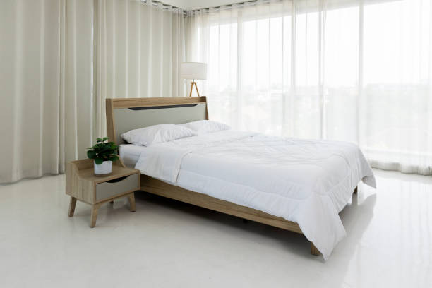 istock The comfortable bedroom in minimal style with clear light from glass window 2192788502