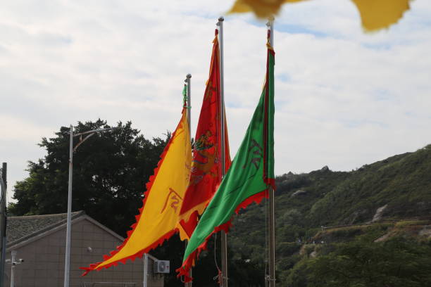 istock Three flags, red, yellow, and green, with dragons and darts on them 2192789845