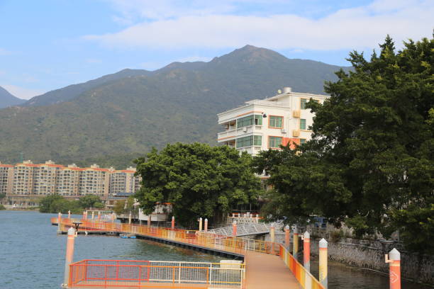 A city with a river and a mountain in the background
