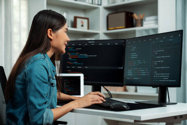 istock Young Asian in IT creating with typing online information on pc. Stratagem. 2192790075