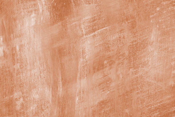istock Concrete, plaster wall texture with brush strokes, orange surface with brush strokes background 2192791063